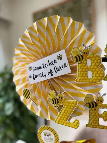 "Soon to bee a family of three." I love adding these little personalized notes and themed decorations to make the gift extra special and memorable.