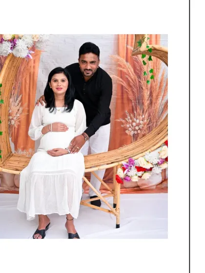 A happy couple posing with our crescent-shaped wicker prop. This unique piece adds a whimsical touch to the Boho theme, and the floral arrangement brings in a pop of color.