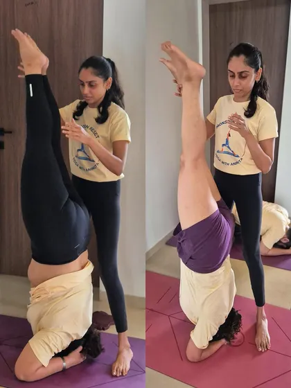 Providing hands-on assistance to students working on their Sirsasana (Headstand). In my retreats, I ensure everyone receives individual attention to safely explore and advance their practice.