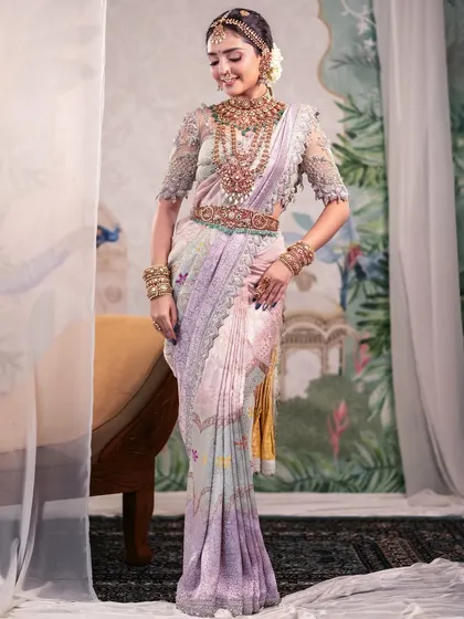 Bridal elegance isn't always about bold colors. This portrait captures a softer side of tradition, with a beautiful pastel Kanjeevaram saree and delicate lace details, set against a hand-painted backdrop in my studio.