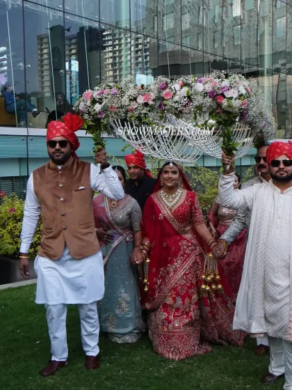 The bride's entry is one of the most awaited moments. Here, Priyanka makes her way to the mandap under a delicate 'phoolon ki chaadar' held by her loved ones.
