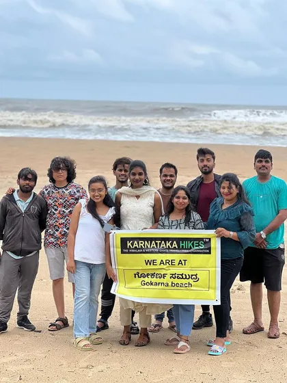 Another happy group photo at Gokarna beach, celebrating a fun weekend trip.