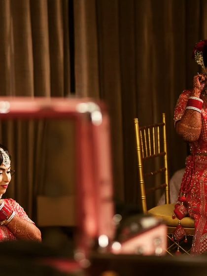 A candid shot of my bride getting her final touches in front of the mirror. It's that last look before she walks out to her new beginning.