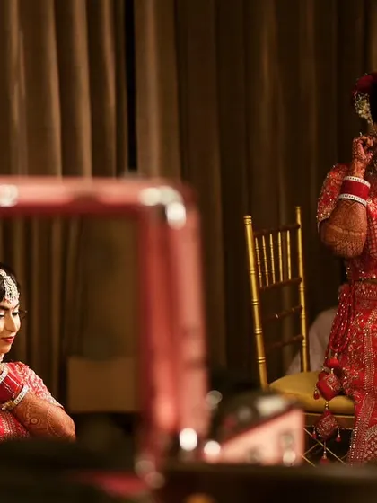 A candid shot of my bride getting her final touches in front of the mirror. It's that last look before she walks out to her new beginning.