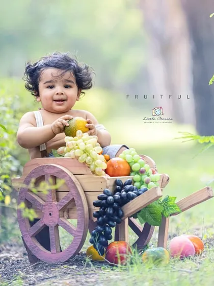 This portrait uses a mix of textures and colors from the fruit and the wooden cart to create a rich, sensory image.