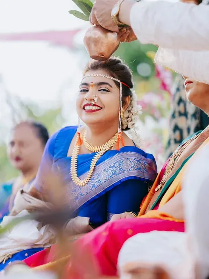 A candid shot of a bride's beautiful smile during a wedding ritual. My goal is to capture the authentic emotions and small, happy moments that make up your special day.