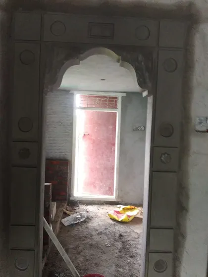 A simple, clean arch design for an interior doorway. Even without heavy ornamentation, a custom-shaped arch adds more character than a standard rectangular door frame.