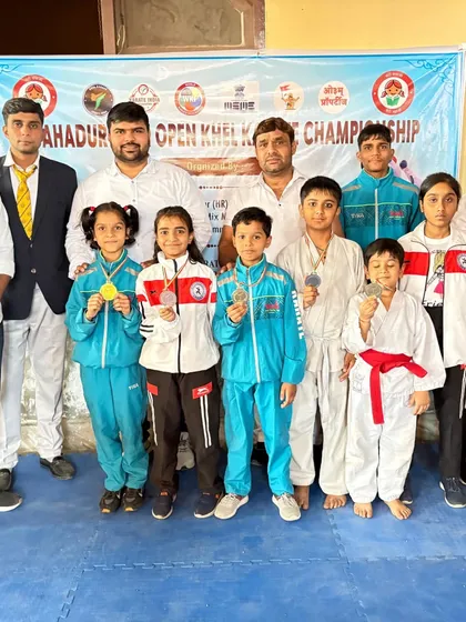 A group of my students with their medals after a successful competition. Their unity and hard work shine through.