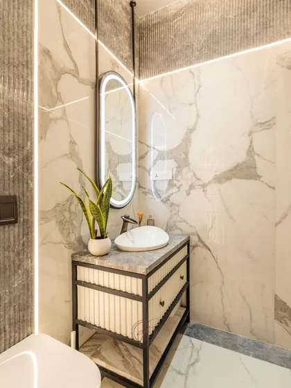 This angle highlights the suspended vanity and the beautiful marble textures on the walls and floor. The design is clean, modern, and luxurious.