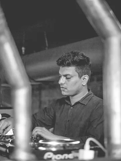 A shot of me deep in concentration at the console. Whether it's a high-energy club night or a sophisticated corporate event, I give my full attention to reading the room and playing the perfect track at the perfect moment.