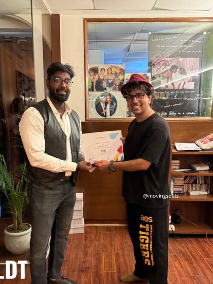 Presenting a certificate to a graduate of our PLDT program. We wish all our students the very best in their future dance endeavors.