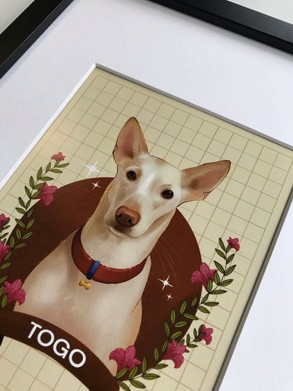 A close-up of the framed digital portrait of Togo. The details, from the sparkles to the floral elements, look crisp and vibrant when printed and framed.