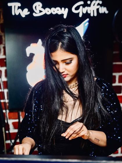 A focused moment at The Boozy Griffin, Marathahalli. This image shows my concentration while preparing the next mix.