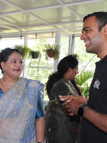 We partner with schools to bring our curriculum to their campus through our 'The Little Gym Outside' program. Here, our director speaks with a parent during an orientation day at First Steps Bangalore.