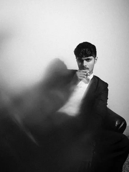 More from the black and white tuxedo series, exploring different poses and lighting angles. I used smoke and shadows to add texture and mood.