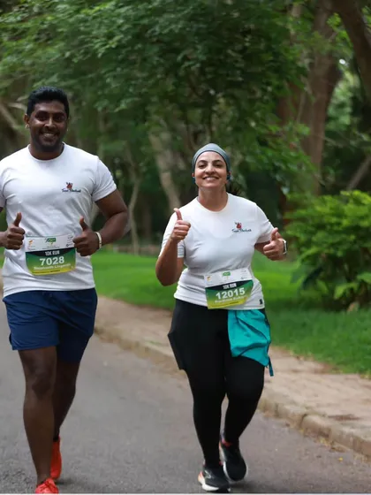 All smiles during the Mysuru Run. Running with a team makes even the toughest parts of the race enjoyable.