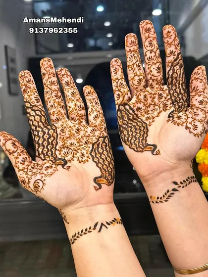 A light and graceful design featuring peacocks on the palms with delicate leafy vines on the wrists. This is a beautiful choice for a festive occasion.