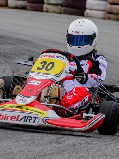 Abhay Mohan in kart number 30, focused and determined as he navigates a turn during a race in the Indian championship.
