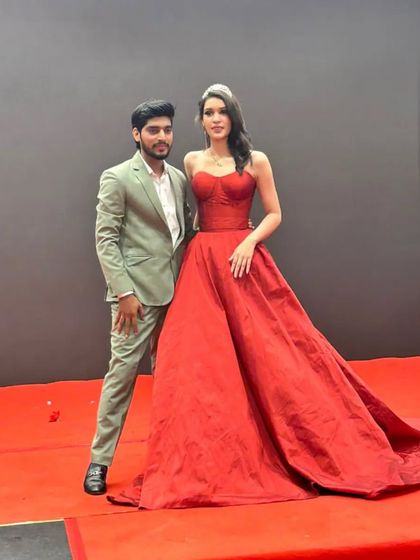 A red carpet moment with one of my creations. This dramatic red gown was designed to feel like a real-life Barbie or Disney princess dress, perfect for making a statement.
