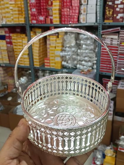 A new arrival, this German silver basket has a beautiful floral-embossed base and a unique rim design.
