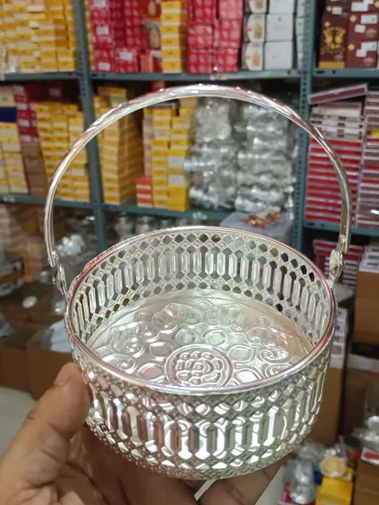 A new arrival: a German silver flower basket with a new latticework pattern, perfect for your pooja collection.