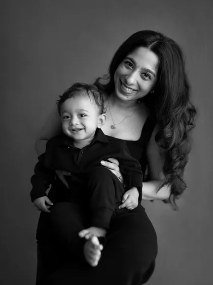 A classic black and white portrait of a mother and her son. This timeless style removes all distractions and focuses purely on their expressions and connection.