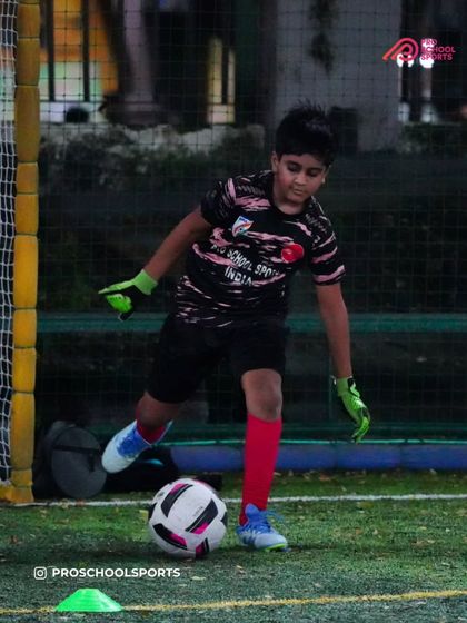 A young goalkeeper practices their distribution and footwork, key skills for the modern game.