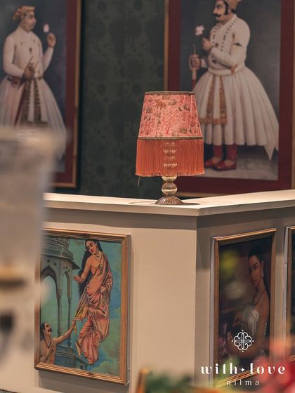 A custom-built bar adorned with Raja Ravi Varma paintings. Even functional elements like the bar were integrated into the artistic theme, creating a seamless and immersive experience.