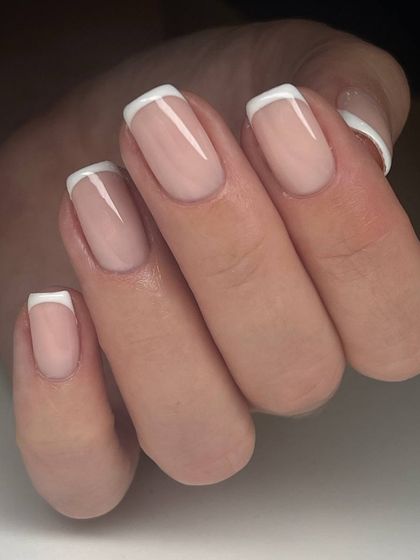 A classic French manicure on square-shaped nails, showcasing the clean, crisp lines and timeless appeal of this popular design.