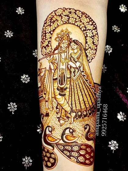 The divine couple, Radhe Krishna, surrounded by peacocks. This full-figure design captures their love story, complete with a halo of intricate floral patterns.
