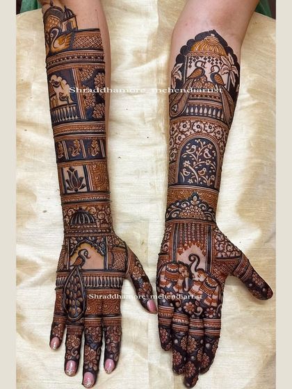 I love creating designs that flow beautifully up the arm. This piece features elephants, peacocks, and swans, with a mix of delicate jaali (net) patterns and bold floral work.