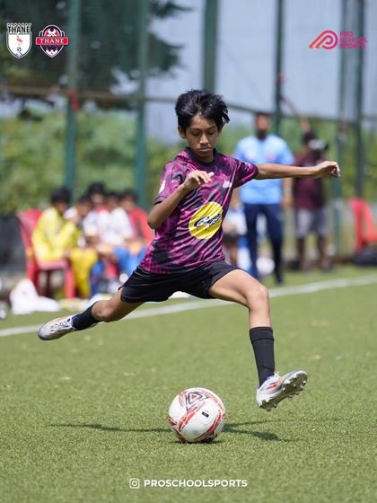 A powerful shot from one of our U13 players during a competitive game.