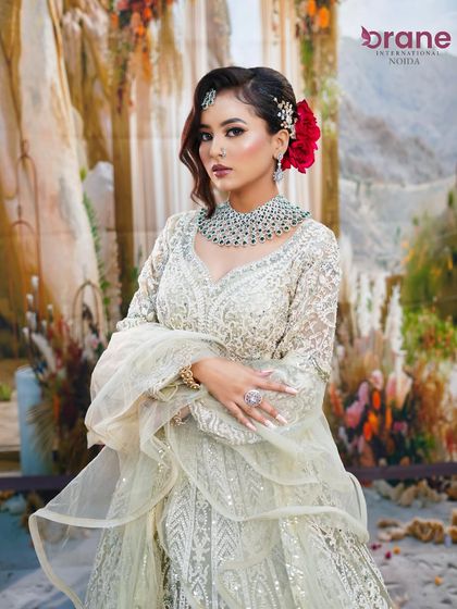 This modern party look features a chic, embroidered lehenga and makeup that is both elegant and striking.