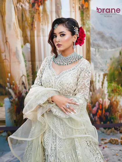 This modern party look features a chic, embroidered lehenga and makeup that is both elegant and striking.