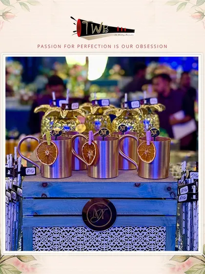 Custom-branded copper mugs and pineapple glasses at the JW Marriott Bangalore welcome soirée.