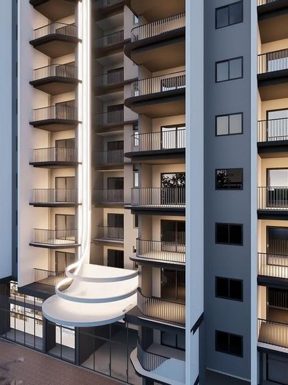 A closer view of the apartment facade, showing how the curved elements at the base of the vertical fins soften the building's form. This detail adds a touch of elegance and unifies the overall design.