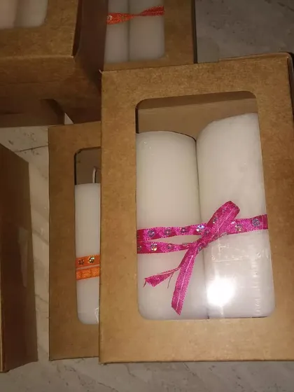 For a simple and elegant look, I offer classic white pillar candles. Here they are packaged in pairs in a simple kraft box with a window, making for an affordable yet thoughtful gift.