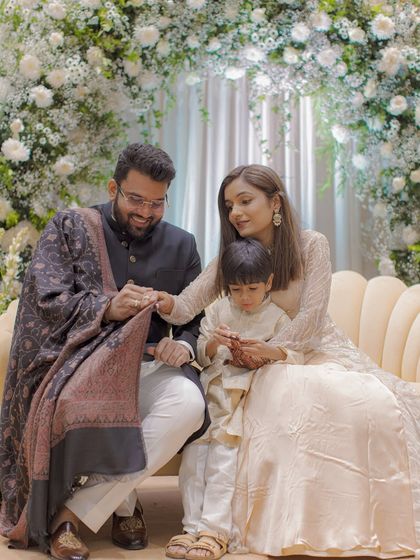 A heartwarming family portrait during an engagement ceremony, with a young child sharing the special moment. We love capturing these beautiful new family dynamics.