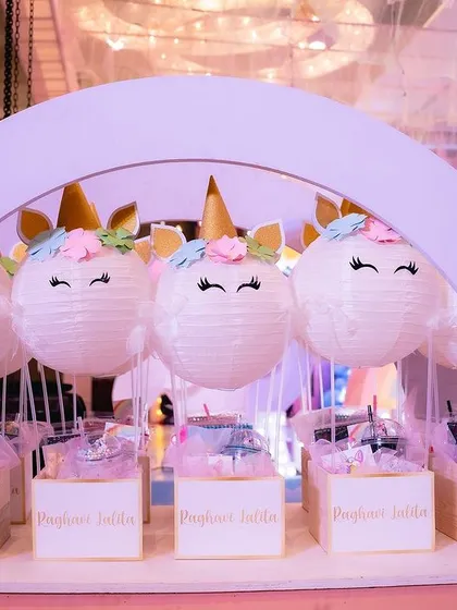 A custom-built cart to display the unicorn-themed return gifts. The paper lantern unicorns with their little golden horns were a huge hit with the kids.