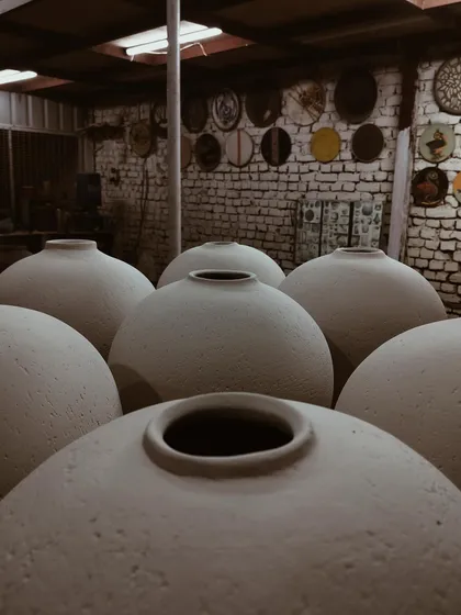 A group of bisque-fired Moon Jars waiting in my studio. Their simple, powerful forms create a sense of calm and unity.