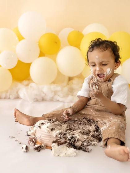Another angle of the joyful mess, showing just how much fun a cake smash can be.