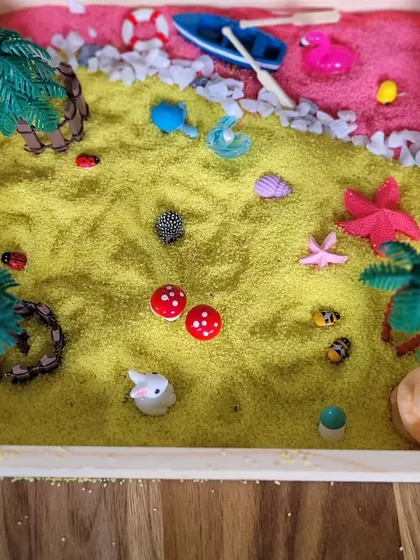 Another unique creation from the Zen Garden workshop. This one uses yellow sand and miniature mushrooms, animals, and trees to build a tiny, tranquil world in a box.