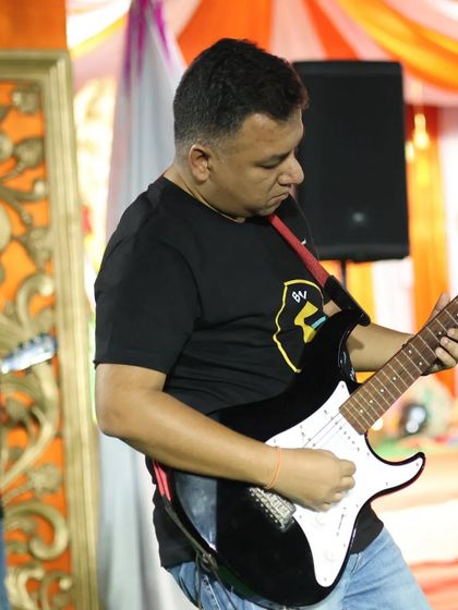 Jamming on stage with my student. These live performances are a fantastic way for students to showcase what they've learned in our online classes.