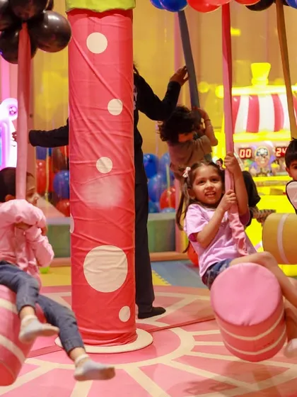 Our candy-themed swing carousel is always in motion. It's a delightful ride that brings smiles to everyone's faces.