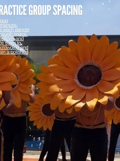 For group performances, we practice group spacing to ensure a polished look. Here, dancers with large sunflower props create a stunning visual.