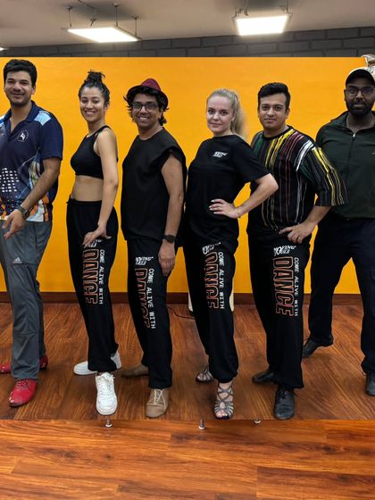 A photo of our team and students at our newly renovated Shivalik studio. The energy and camaraderie are what define us.