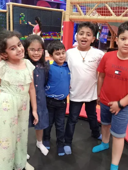 Friends having a great time together on the trampoline. Our play area is designed to encourage social interaction and shared fun.