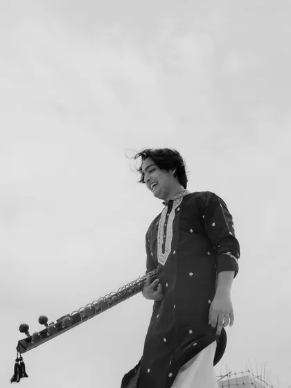 A candid black and white photo from the "Rang Morla" shoot, capturing a moment of laughter.