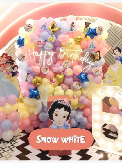 A fairy tale comes to life with this Snow White theme. We used a beautiful balloon wall and character cutouts to create a magical forest setting for the birthday princess.