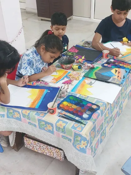 Another shot of our little artists at work. The table is full of colors and creativity.
